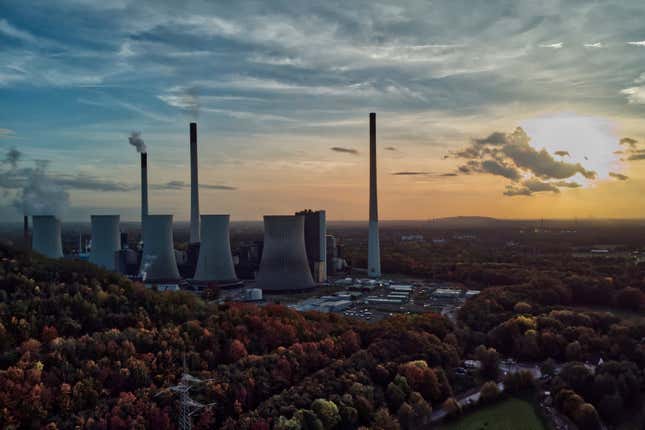 FILE - The sun sets behind the cole-fired power plant &#39;Scholven&#39; of the Uniper energy company in Gelsenkirchen, Germany, on Oct. 22, 2022. Germany&#39;s economy shrank 0.3% last year as Europe&#39;s former powerhouse struggled with more expensive energy, higher interest rates, lack of skilled labor and a home-grown budget crisis. (AP Photo/Michael Sohn, File)