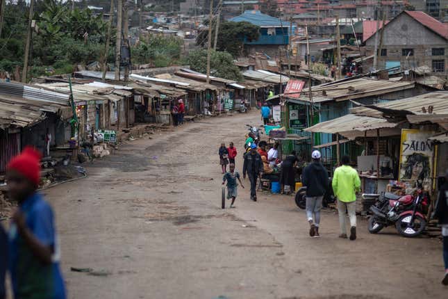 FILE - People walk down a street in Kibera neighborhood, a stronghold of presidential candidate Raila Odinga, in Nairobi, Kenya, on Aug. 11, 2022. A nationwide power blackout hit Kenya Sunday evening, Dec. 11, 2023, paralyzing large parts of the country, including the main airport in the capital, Nairobi, a major transport hub connecting East Africa to Asia, Europe and other parts of the world. (AP Photo/Mosa&#39;ab Elshamy, File)