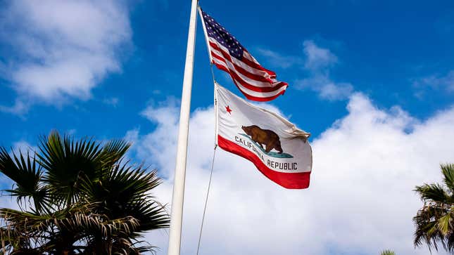 US flag and California flag on flag pole.