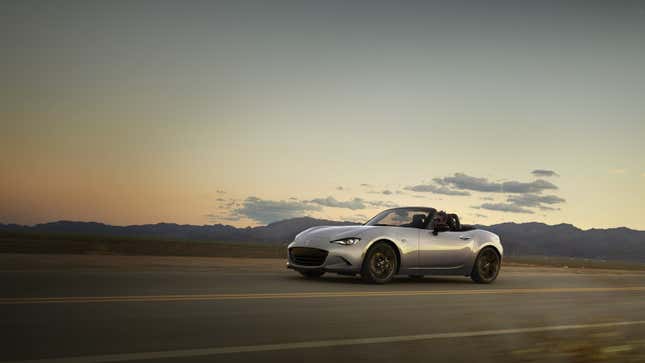 A photo of a silver Mazda Miata sports car. 