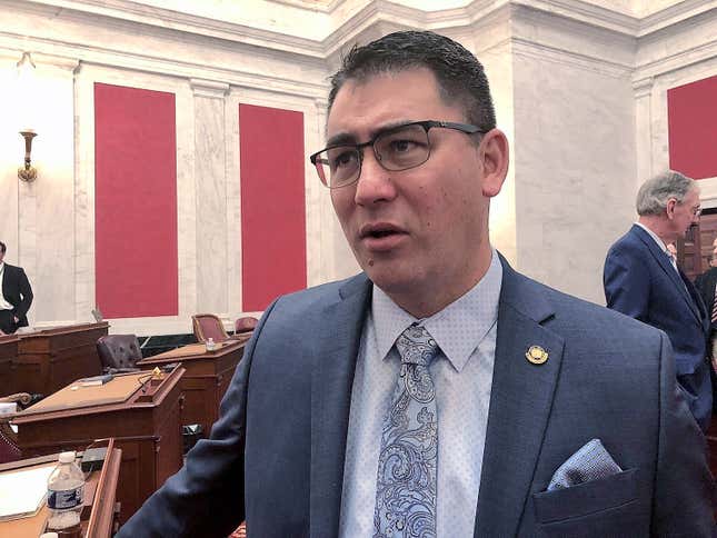 FILE - West Virginia Senate Majority Leader Tom Takubo, a Kanawha County Republican, listens to a colleague before the start of the 2020 regular legislative session Wednesday, Jan. 8, 2020, in Charleston, W.Va. The Senate passed a bill Monday, Feb. 12, 2024, that would ban smoking in cars when children age 16 and under are present. Takubo, a lung doctor, is the lead sponsor of the bill, which now goes to the House of Delegates. (AP Photo/John Raby, File)