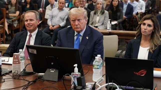 Donald Trump appears in court next to his attorneys. 