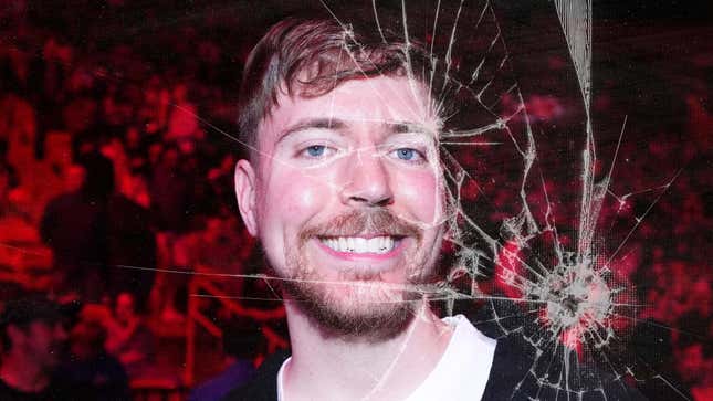 An image shows MrBeast behind a broken glass screen. 