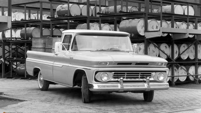 A black and white photo of a Chevrolet pickup truck. 
