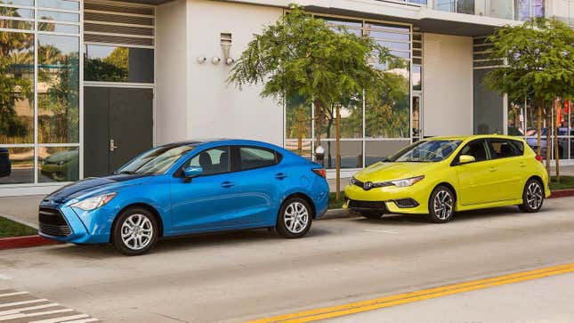 A bright blue Scion iA and a bright yellow Scion iM parked on a street