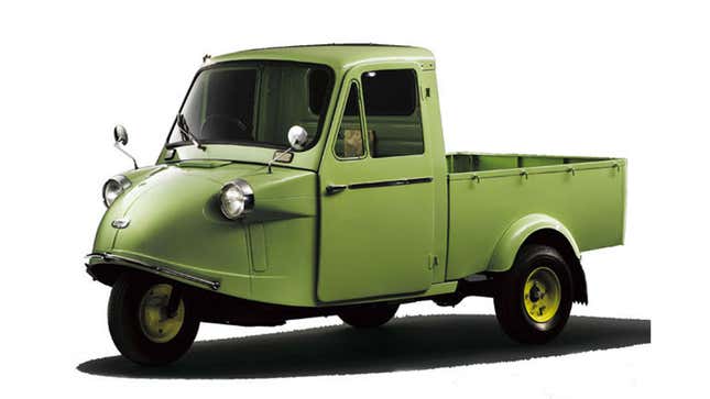 A photo of a Daihatsu Midget green truck. 