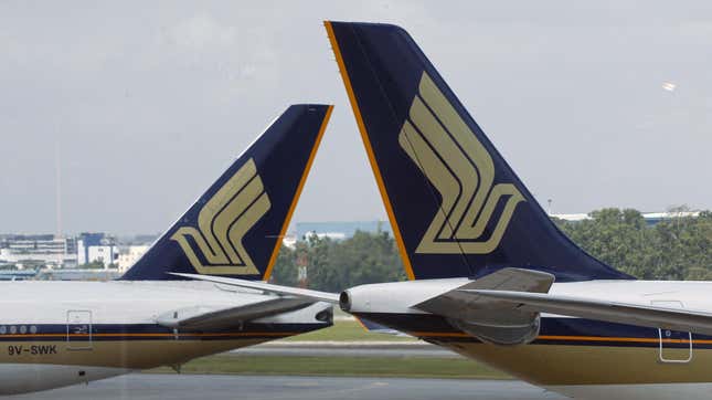 The tails of two SIngapore Airlines planes