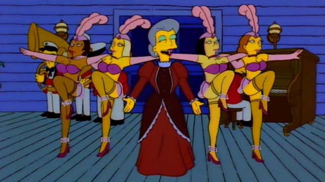 A screenshot of The Simpsons shows women dancing in front of a band. 