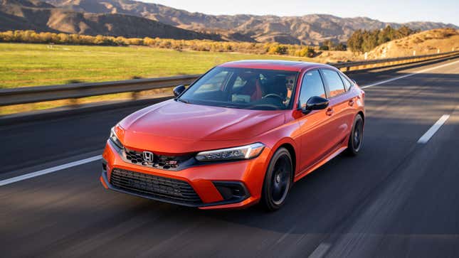 A photo of an orange Honda Civic SI. 