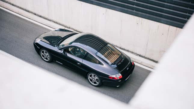 Rear 3/4 view of a black 996 Porsche 911