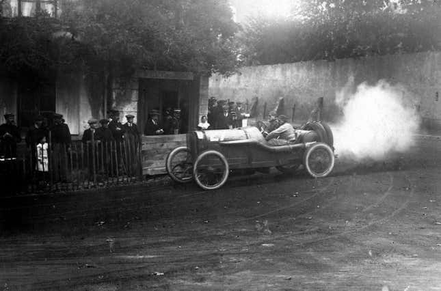 Jules Goux of France and his riding mechanic aboard the #27 Peugeot L-76 during the I Coupe de la Sarthe voiturette race on 9 September 1912 at the Sarthe circuit, Le Mans, France