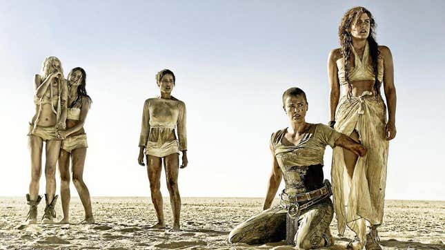 The women of Mad Max: Fury Road stand together on the very dry land of the world.