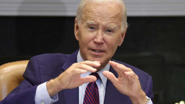 A photo shows Joe Biden looking concerned with his hands up. 