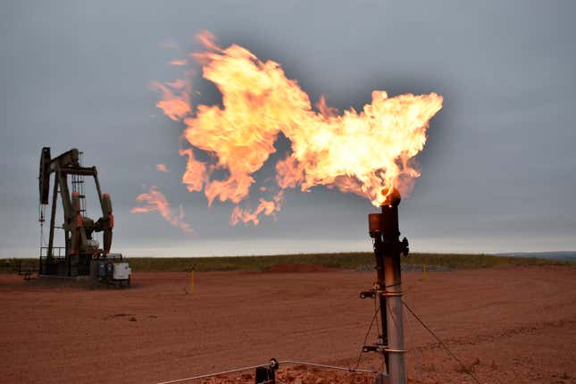 FILE - A flare burns natural gas at an oil well Aug. 26, 2021, in Watford City, N.D. Oil and natural gas companies would have to pay a fee for methane emissions that exceed certain levels under a new rule proposed by the Biden administration. The rule, announced in December 2023, includes a two-year phase-in period for companies to eliminate routine flaring of natural gas from new oil wells. (AP Photo/Matthew Brown, File)