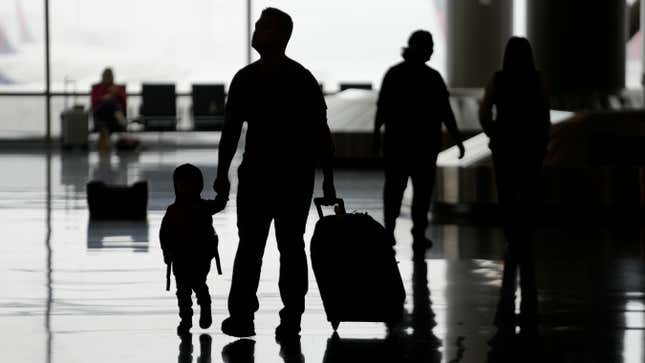 FILE - People travel through Salt Lake City International Airport on Wednesday, Feb. 22, 2023, in Salt Lake City. When discussing a multigenerational family trip, have a plan to avoid arguments around topics like when to travel, where you’ll go, what you’ll do there or how you’ll split bills. With groups, it’s often best for each family unit to book their lodging and transportation. (AP Photo/Rick Bowmer, File)