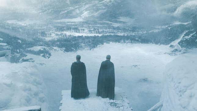 Two men in cloaks look out over the North