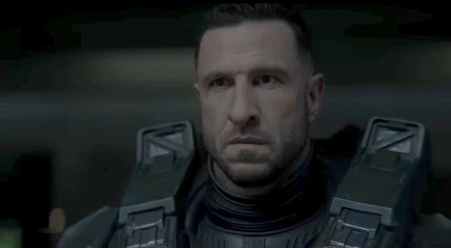 Master Chief (Pablo Schreiber) stares at something off screen with a slight scowl on his face.