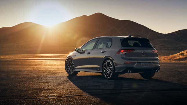 A grey VW Golf GTI parked up at sunset. 