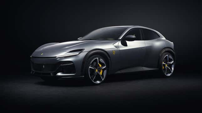 A silver Ferrari Purosangue inside a black studio