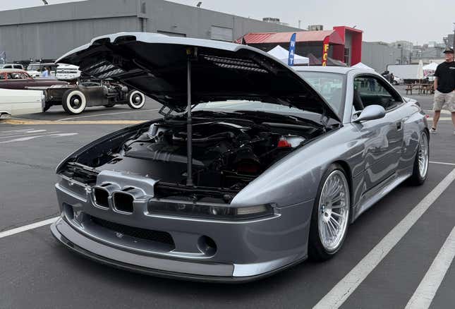 Front 3/4 view of the silver BMW 858 CSL with the hood open