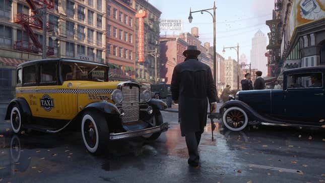 A screenshot of Mafia: Definitive Edition showing the player character walking down the street with a Tommy gun in hand.