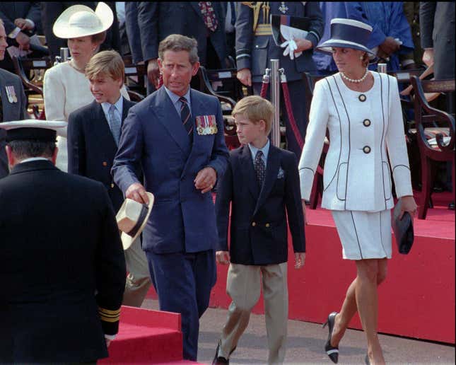 FILE - Prince Charles and Princess Diana escort their children William, left, and Harry, right, onto the Royal stand as VJ-Day commemorations got underway at Buckingham Palace in London, Saturday Aug. 19, 1995. Prince Harry alleged Thursday, March 21, 2024, that the publisher of The Sun tabloid unlawfully intercepted phone calls of his late mother, Princess Diana, and father, now King Charles III, as he sought to expand his privacy invasion lawsuit against News Group Newspapers. (AP Photo/Jacqueline Arzt, File)