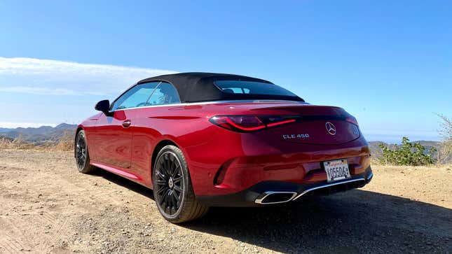 A rear 3/4 shot of the red CLE450 Cabriolet with the top up 