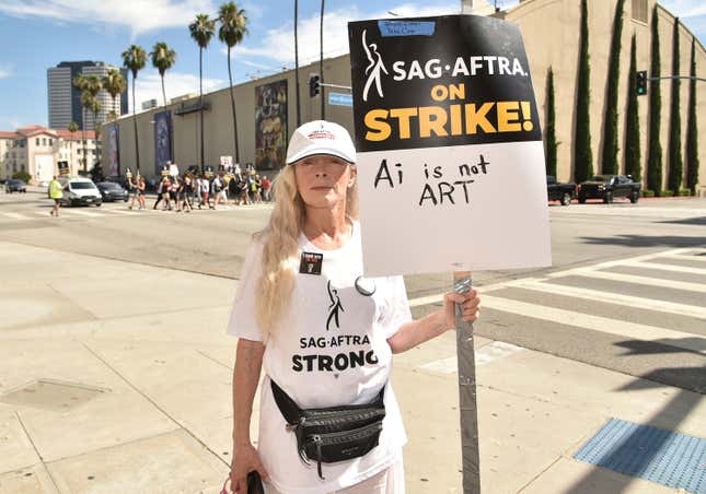 FILE - Frances Fisher appears on a picket line outside Warner Bros. studios on Wednesday, July 26, 2023, in Burbank, Calif. Saturday marks the 100th day that film and TV performers from the Screen Actors Guild-American Federation of Television and Radio Artists have been on strike, seeking changes to compensation and protections from use of artificial intelligence in their craft. (Photo by Richard Shotwell/Invision/AP, File)