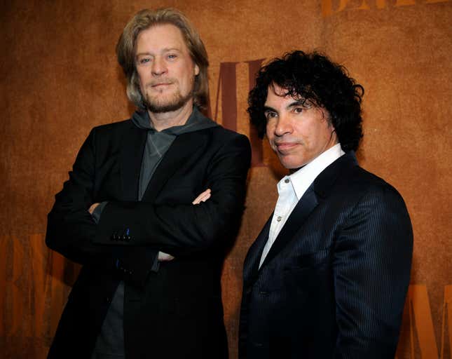 FILE - Daryl Hall, left, and John Oates, recipients of BMI Icons awards, pose together before the 56th annual BMI Pop Awards in Beverly Hills, Calif., on May 20, 2008. Hall has sued his longtime music partner John Oates, arguing that his plan to sell off his share of a joint venture would violate a business agreement the duo had.(AP Photo/Chris Pizzello, File)