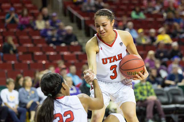 SEATTLE, WASHINGTON - MARCH 3: Utah’s Malia Nawahine (3) helps teammate Tanaeya Boclair (32) up during the first game of the PAC-12 Women’s Tournament in Seattle, WA