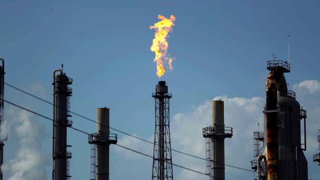 A flame burns at the Shell Deer Park oil refinery in Deer Park, Texas.