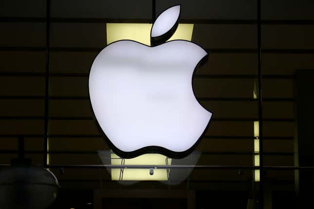 FILE - The Apple logo is illuminated at a store in the city center of Munich, Germany, Dec. 16, 2020. Apple Inc. is raising the prices for its AppleTV+ streaming and Arcade gaming plans, as well as its bundled Apple One service that includes streaming, music and other subscriptions. (AP Photo/Matthias Schrader, File)