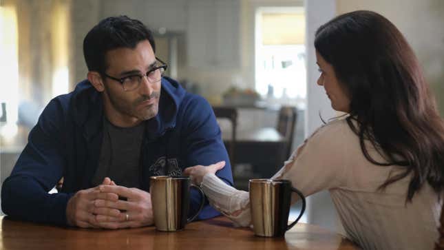 Clark Kent and Lois Land sit at their kitchen table and talk over coffee.