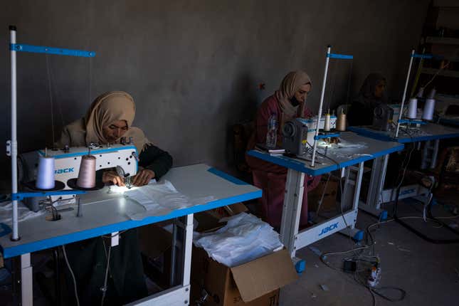 Palestinian women sew diapers in Rafah, southern Gaza Strip, Thursday, Feb. 15, 2024. Palestinians in Gaza have experienced severe shortages of basic necessities since the war began on Oct. 7. (AP Photo/Fatima Shbair)