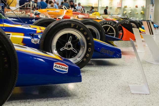 This image focuses on a row of tires as shown on Indy 500-winning vehicles at the Indianapolis Motor Speedway museum.