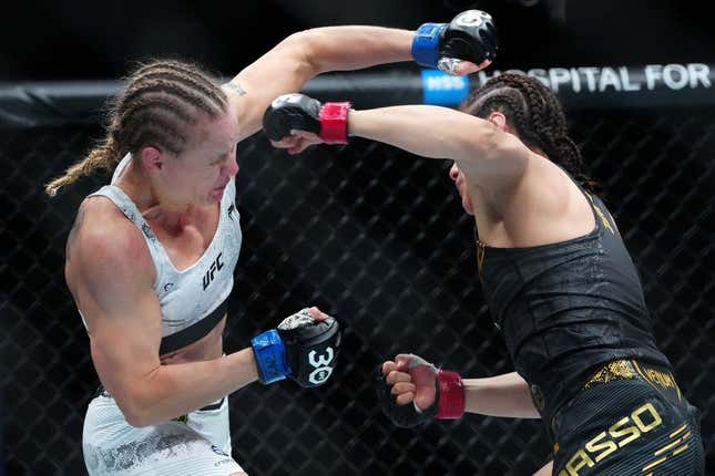 Sep 16, 2023; Las Vegas, Nevada, USA; Alexa Grasso (red gloves) fights Valentina Shevchenko (blue gloves) during UFC Fight Night at T-Mobile Arena.