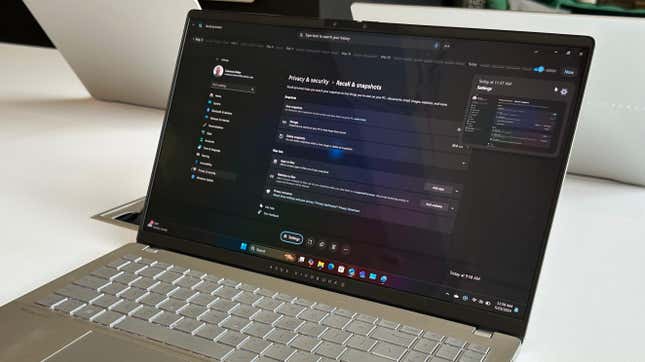 An Asus PC moving  the Recall Feature looking up   privateness  and security.