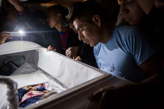 Family members pay their final respects to 7-year-old Jakelin Caal Maquin during a memorial service in her grandparent’s home in San Antonio Secortez, Guatemala, Monday, Dec. 24, 2018.