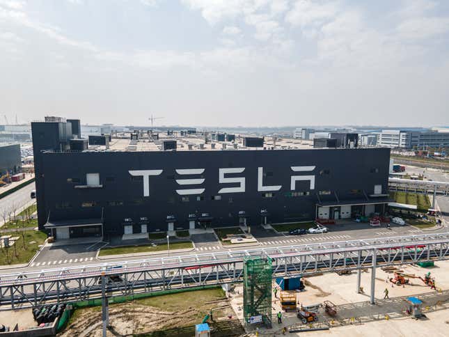 aerial view of Tesla gigafactory with TESLA written on the building