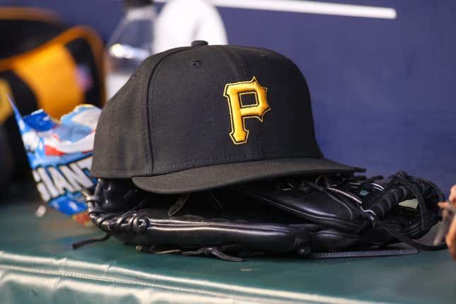 Sep 8, 2023; Atlanta, Georgia, USA; A detailed view of a Pittsburgh Pirates hat and glove before a game against the Pittsburgh Pirates in the first inning at Truist Park.