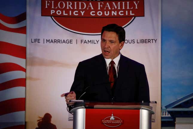 Ron DeSantis speaks from a podium