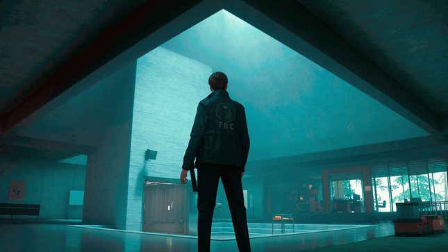 A government agent stands in the lobby of a brutalist building