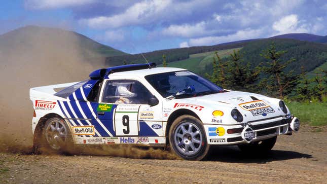 A photo of a blue and white Ford rally car. 