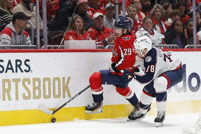 Nov 4, 2023; Washington, District of Columbia, USA; Washington Capitals center Hendrix Lapierre (29) and Columbus Blue Jackets defenseman Damon Severson (78) battle for the puck in the first period at Capital One Arena.