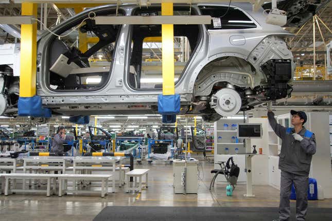 A worker assembles an SUV at a car plant of Li Auto, a major Chinese EV maker, in Changzhou in eastern China&#39;s Jiangsu province on Wednesday, March 27, 2024. Manufacturing in China expanded in March after contracting for five consecutive months, according to an official survey of factory managers released Sunday, suggesting a rebound in industrial activities following the Lunar New Year holiday. (Chinatopix Via AP)