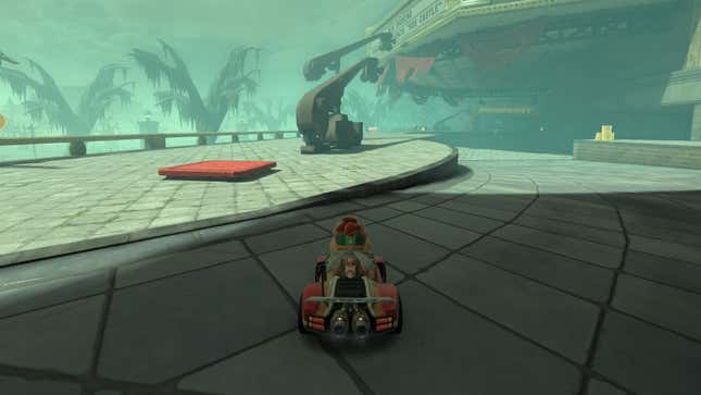 Bowser Jr. sits in a kart in front of a question mark panel.