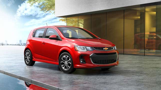 A photo of a red Chevrolet Sonic hatchback. 