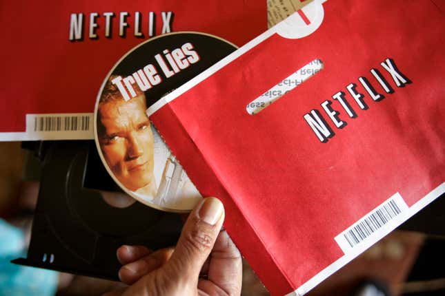 File - Mei Michelson prepares to watch a Netflix DVD at her home in Palo Alto, Calif., on Oct. 22, 2007. The Netflix DVD-by-service will mail out its final discs Friday from its five remaining distribution centers, ending its 25-year history. (AP Photo/Paul Sakuma, File)