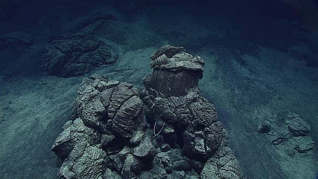 An isolated pillow outcrop surrounded by sediment found during a 2016 expedition to the bottom of the Mariana Trench.