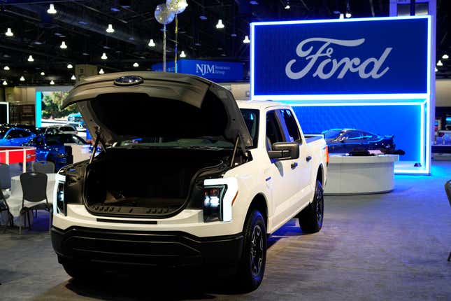 FILE - The Ford F-150 Lightning displayed at the Philadelphia Auto Show on Jan. 27, 2023, in Philadelphia. Ford says it’s reducing production of the F-150 Lightning electric pickup vehicle as it adjusts to weaker-than-expected electric vehicle sales growth. (AP Photo/Matt Rourke, File)